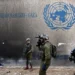 Israeli soldiers operate next to the UNRWA headquarters in the Gaza Strip, in February 2024.