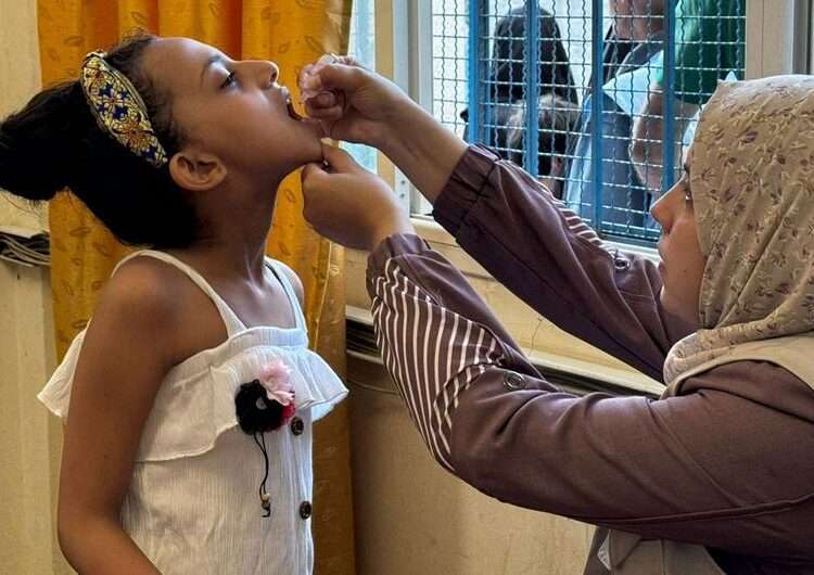 A child receives the polio vaccine in Gaza.