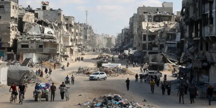 Palestinians carry their belongings as they flee areas north of Gaza City in the northern Gaza Strip.