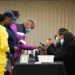 People sign in to cast their votes on the first day of early voting at East Point First Mallalieu United Methodist Church in Atlanta, Georgia.