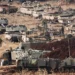 Israeli soldiers work on tanks at a staging area in northern Israel near the Israel-Lebanon border.