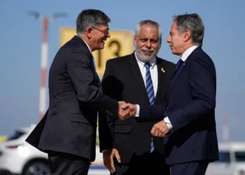 US Secretary of State Antony Blinken, right, is welcomed by US ambassador to Israel Jack Lew, left, and Israeli Ministry of Foreign Affairs Deputy Director General for North America Lior Hayat in Tel Aviv, Israel on Tuesday, October 22, 2024.