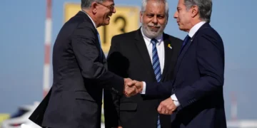 US Secretary of State Antony Blinken, right, is welcomed by US ambassador to Israel Jack Lew, left, and Israeli Ministry of Foreign Affairs Deputy Director General for North America Lior Hayat in Tel Aviv, Israel on Tuesday, October 22, 2024.