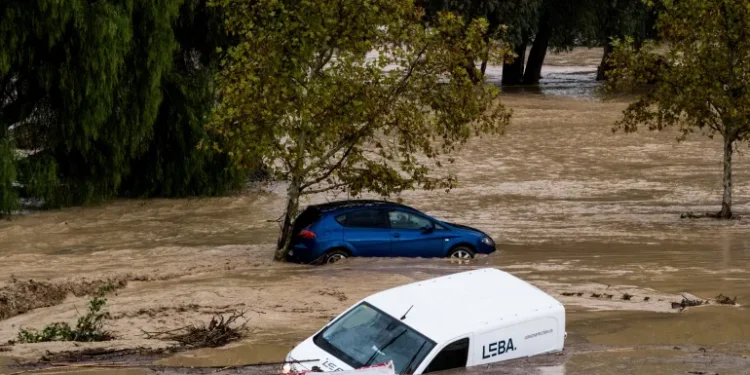 Cars swept away by the water, after floods preceded by heavy rains caused the river to overflow its banks in the town of Alora, Malaga, Spain.