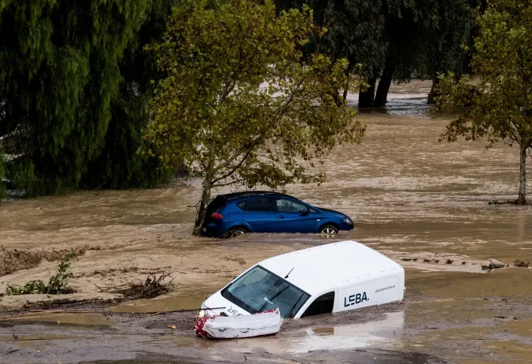 Cars swept away by the water, after floods preceded by heavy rains caused the river to overflow its banks in the town of Alora, Malaga, Spain.