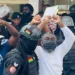Osagyefo Mawuse Oliver Barker-Vormawor in a handcuff and being escorted by the Police