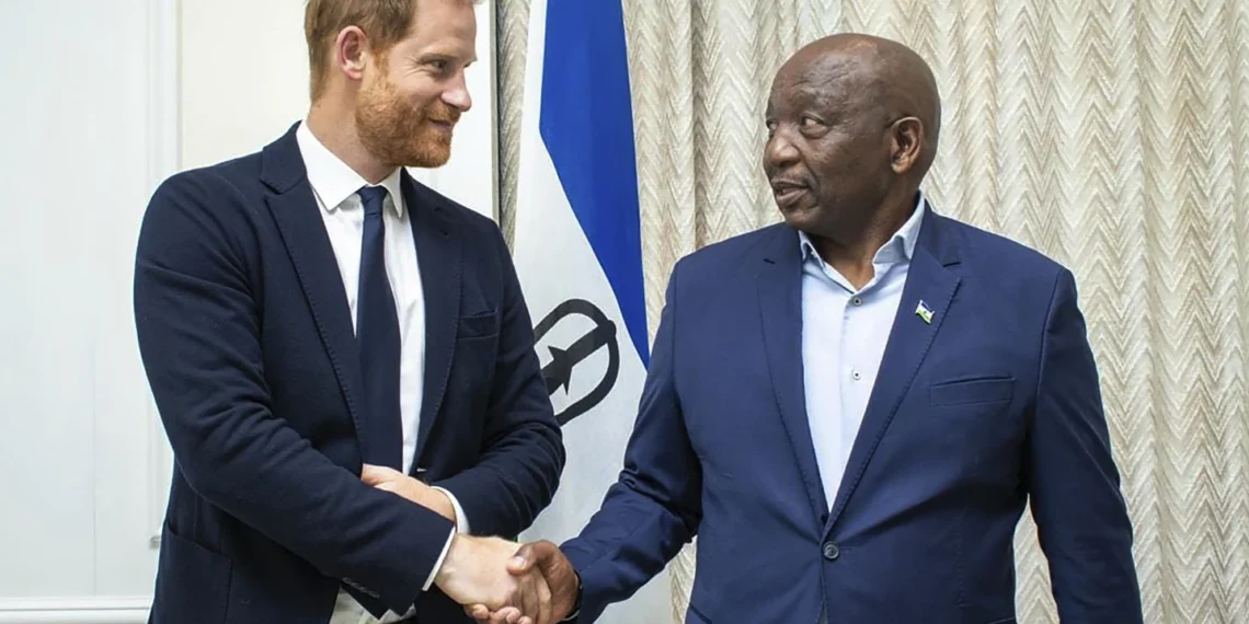 Britain's Prince Harry left, shakes hands with Lesotho's Prime Minister Sam Matekane