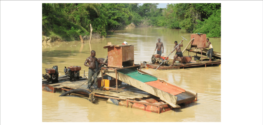 Ewe miners dredge mine the Offin River and pits left by Chinese