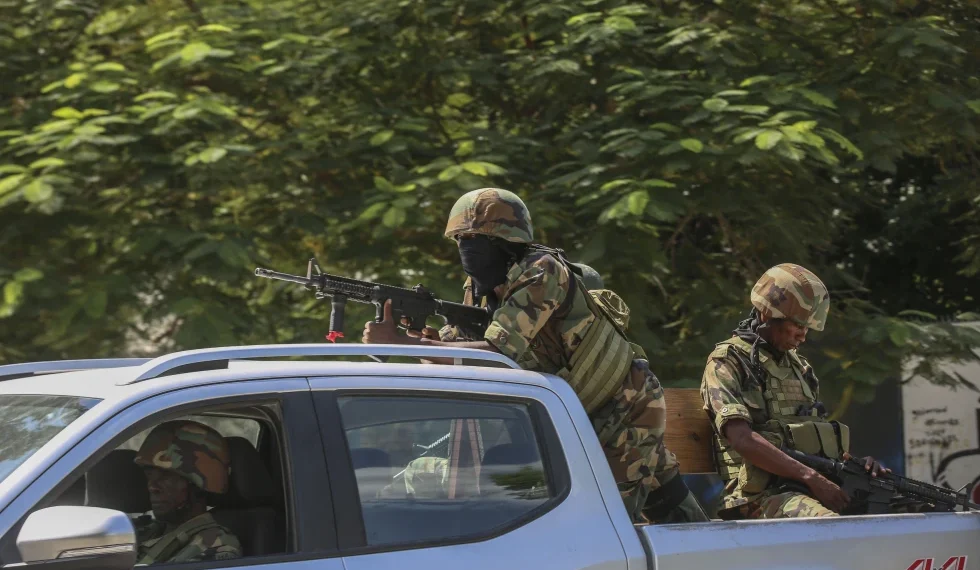 Soldiers patrol amid the sound of gunshots heard in the distance, in Port-au-Prince, Haiti