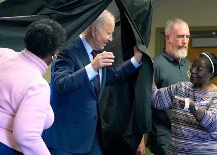 President Joe Biden exits the voting booth after casting his early-voting ballot for the 2024 general elections on October 28, in New Castle, Delaware.