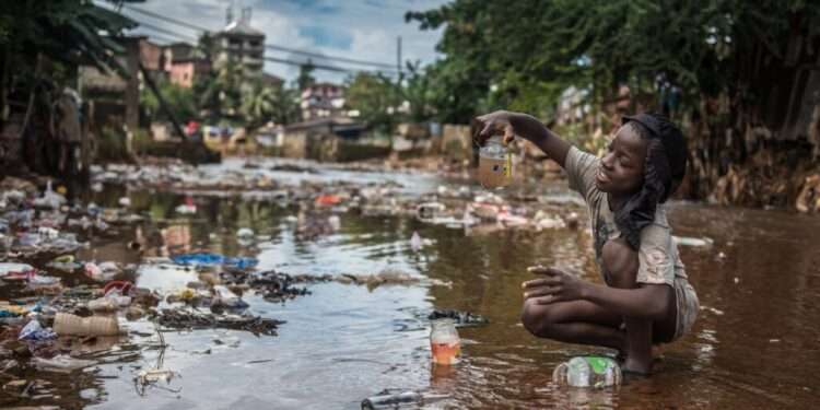Outbreak of Cholera in Ada 1 A child sitting in a Garbage dump