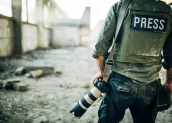 man war journalist with camera