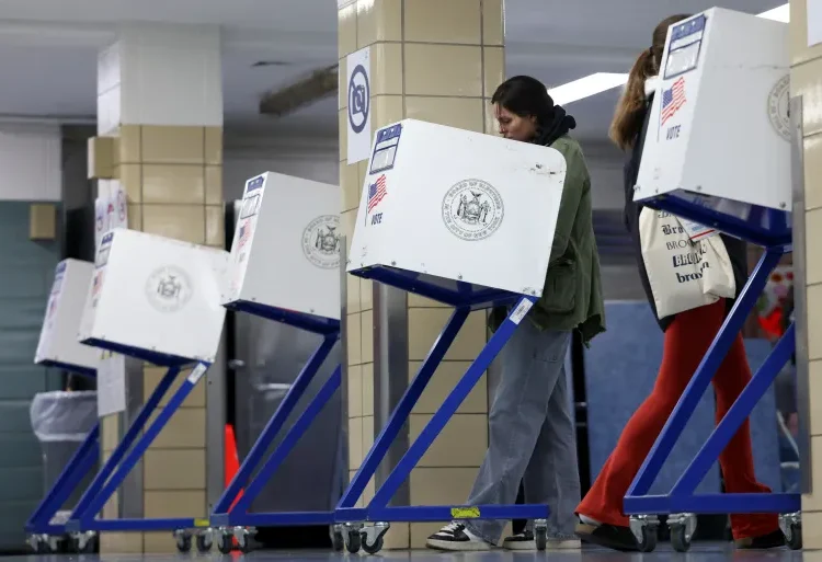 U.S Election Day In Full Swing 1 A person votes at PS20 Anna Silver Elementary School on Election Day for the 2024 US presidential election in Manhattan, New York City.