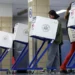 A person votes at PS20 Anna Silver Elementary School on Election Day for the 2024 US presidential election in Manhattan, New York City.
