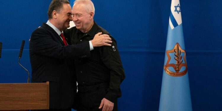 Katz Sworn In As Israel’s New Defense Minister 1 Incoming Defense Minister, Israel Katz (L) embraces Yoav Gallant at a handover ceremony in the defense ministry after Gallant was fired from the post, November 8, 2024.