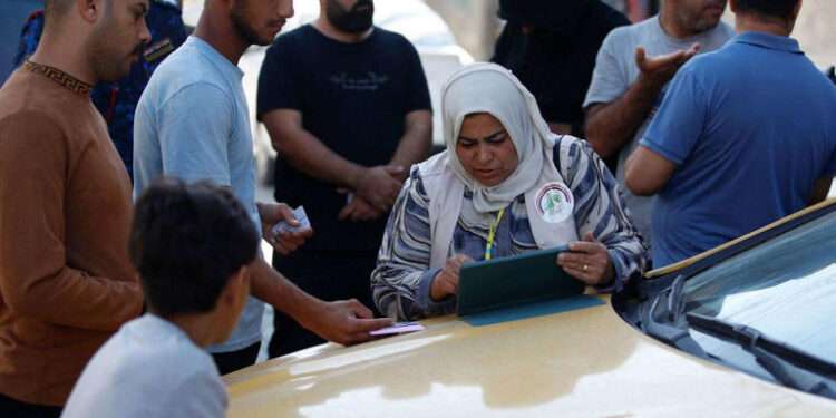 A team from Iraq's planning ministry carries out the national population census in Baghdad on November 20, 2024.
