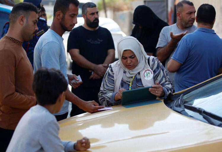 A team from Iraq's planning ministry carries out the national population census in Baghdad on November 20, 2024.