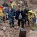 Spain Floods Death Toll Rises To 205 12 Emergency services staff help a man after deadly floods in Letur in southeastern Spain on October 30, 2024.