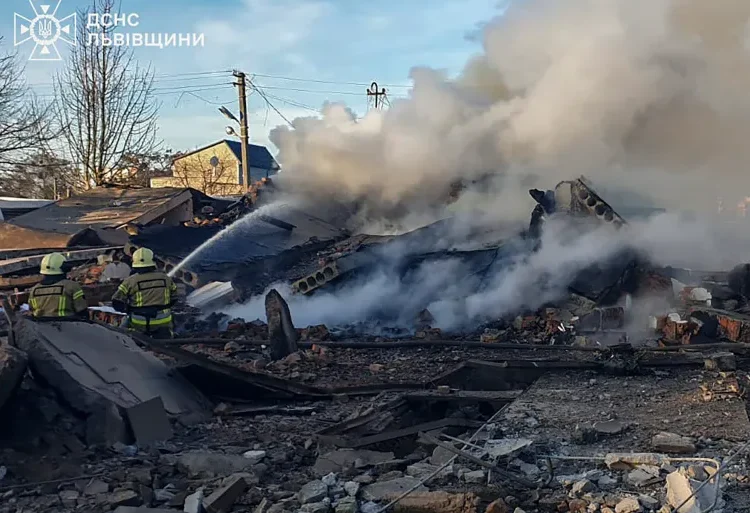 Russia Launches Massive Strike On Ukraine’s Energy System 1 n this photo provided by the Ukrainian Emergency Service, emergency services personnel work to extinguish a fire following a Russian rocket attack in Lviv, Ukraine.