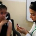 Global Measles Surge Sparks Alarm for Health Officials 13 A schoolgirl receives a measles vaccine at a school in Baghdad, Iraq