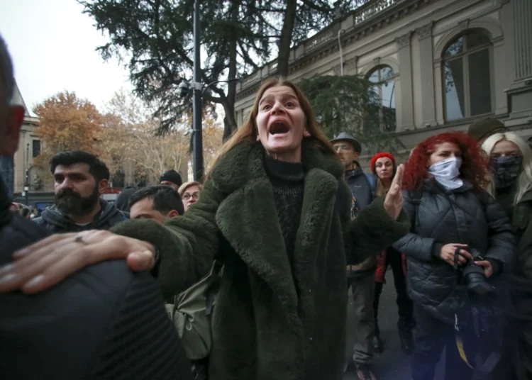 A protester shouts outside the Georgian parliament building.