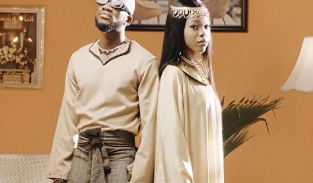 A screenshot from Mr Drew's Mood music video showing him and model Aaliyah