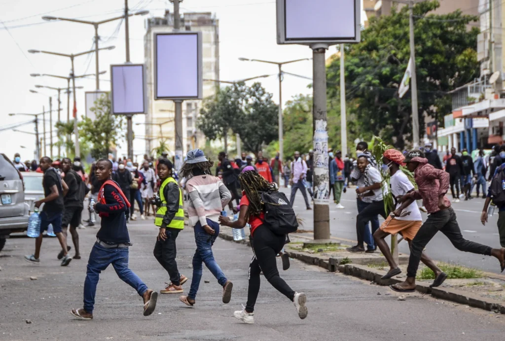 protesters running in Maputo Mozambique