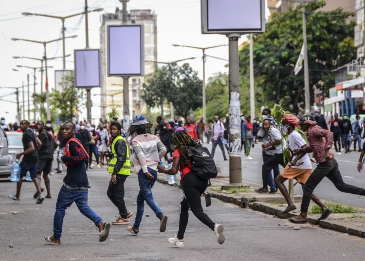 Mozambique Protests Turn Deadly Amid Election Dispute 1 Protesters running from security forces in Maputo
