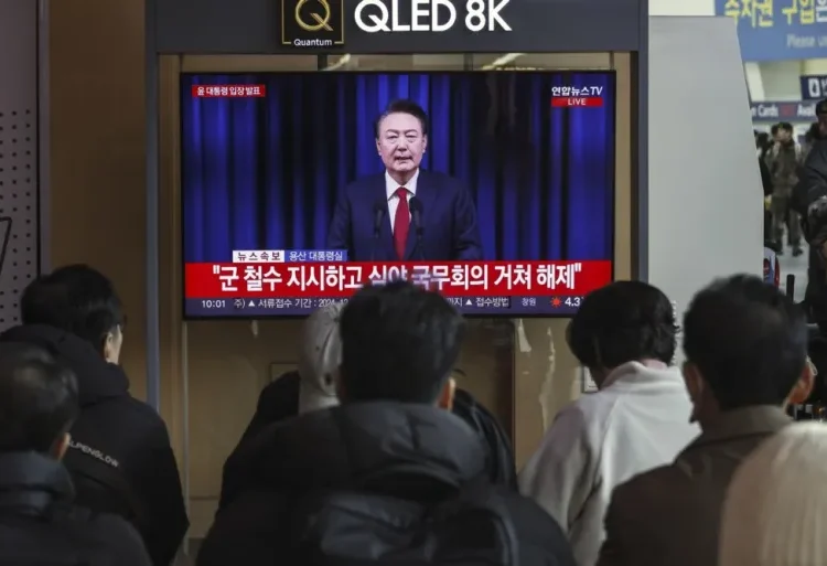 Yoon Apologises For Martial Law Crisis 1 A TV screen shows a live broadcast of South Korean President Yoon Suk-yeol addressing the nation in advance of an impeachment vote, in Seoul, South Korea, on Saturday.