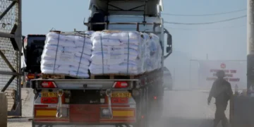 A truck carries humanitarian aid destined for the Gaza Strip at the Karem Abu Salem crossing in southern Israel, November 11, 2024.