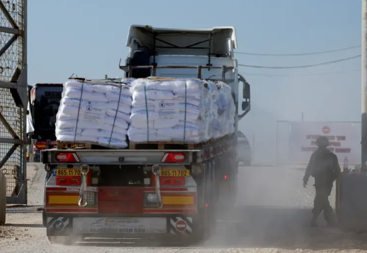 Almost Impossible Task Of Aid Delivery In Gaza Bemoaned 1 A truck carries humanitarian aid destined for the Gaza Strip at the Karem Abu Salem crossing in southern Israel, November 11, 2024.