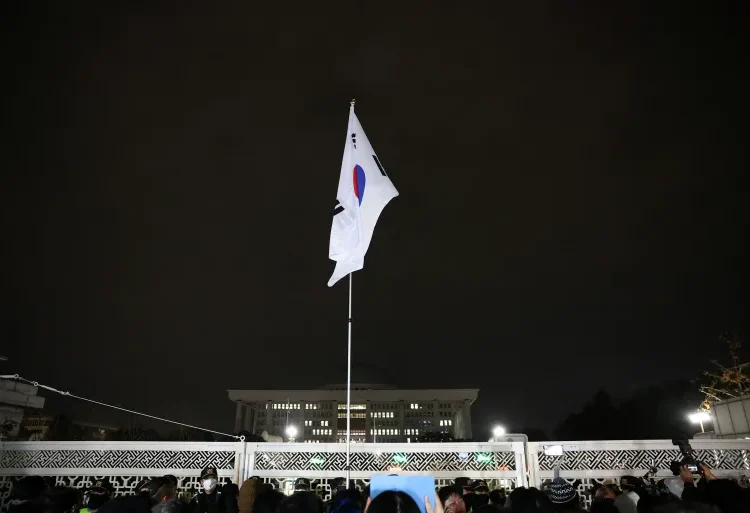 The South Korean flag hangs on a pole outside the gate of the National Assembly in Seoul, December 4, 2024.