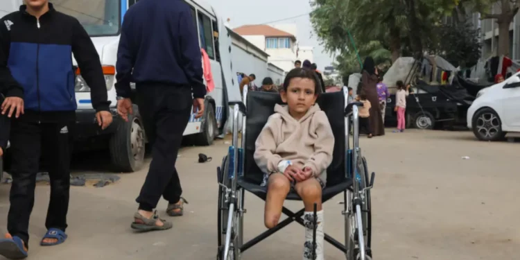 Palestinian girl Eman Al-Kholi, whose limb was amputated after being wounded in an Israeli strike.