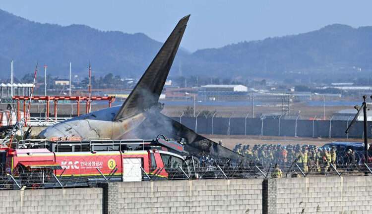 South Korea Declares Seven-Day National Mourning Period Over Plane Crash 1 Firefighters and rescue team members work on the runway of Muan International Airport in Muan, South Korea, Sunday, Dec. 29, 2024.