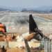 The remnants and debris of the Jeju Air passenger plane, which exploded after attempting a belly landing and colliding the previous day, remain on the runway at Muan International Airport in South Jeolla Province.