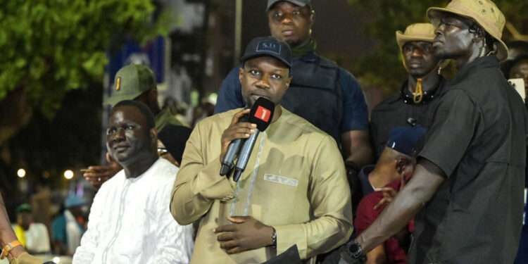 Senegal's Prime Minister and Pastef party leader Ousmane Sonko (C) addresses supporters in Dakar