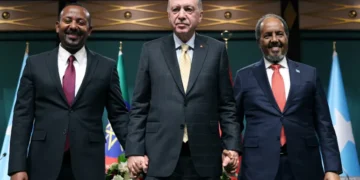 Turkish President Recep Tayyip Erdogan, center, poses with Somali President Hassan Sheikh Mohamud, right, and Ethiopian Prime Minister Abiy Ahmed, left