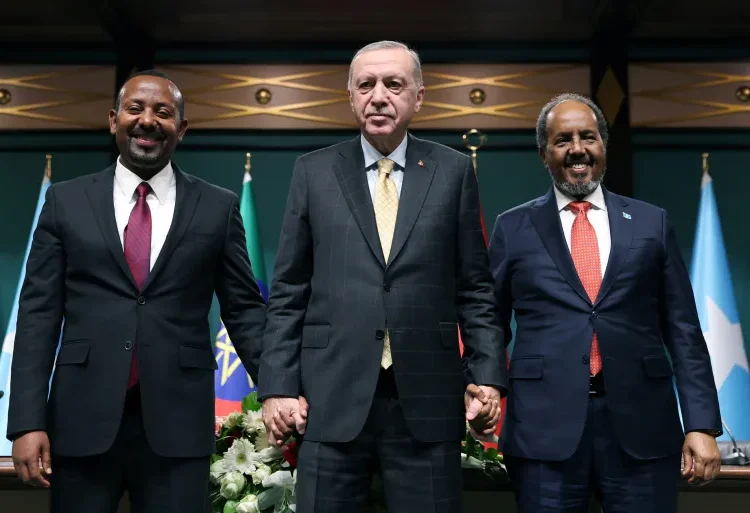 Turkish President Recep Tayyip Erdogan, center, poses with Somali President Hassan Sheikh Mohamud, right, and Ethiopian Prime Minister Abiy Ahmed, left