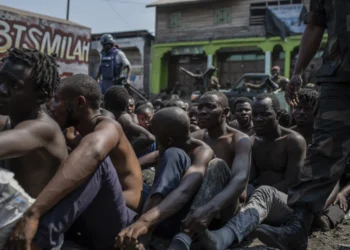 Arrested members of the Wazalendo sect are sat and lined up in Goma, Democratic Republic of the Congo