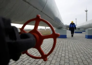 A Gazprom worker walks next to pipelines at a gas measuring station at the Russia-Ukraine border in Sudzha near Kursk.