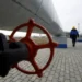 A Gazprom worker walks next to pipelines at a gas measuring station at the Russia-Ukraine border in Sudzha near Kursk.