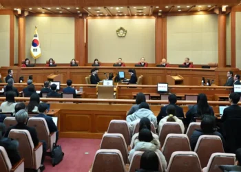Judges Chung Kye-sun, Kim Bok-hyeong, Jung Jung-mi, Lee Mi-son, acting head of the constitutional court Moon Hyung-bae and judges Kim Hyung-du, Cheong Hyung-sik and Cho Han-chang sit for the first formal hearing of a trial on the validity of President Yoon Suk-yeol's impeachment by the National Assembly at the Constitutional Court of Korea on January 14, 2025 in Seoul, South Korea.