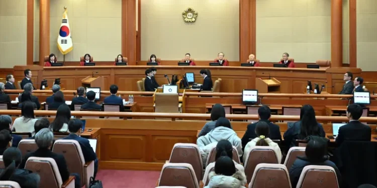 Judges Chung Kye-sun, Kim Bok-hyeong, Jung Jung-mi, Lee Mi-son, acting head of the constitutional court Moon Hyung-bae and judges Kim Hyung-du, Cheong Hyung-sik and Cho Han-chang sit for the first formal hearing of a trial on the validity of President Yoon Suk-yeol's impeachment by the National Assembly at the Constitutional Court of Korea on January 14, 2025 in Seoul, South Korea.