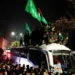 Jubilant Palestinians gather around a Red Cross bus carrying freed Palestinian prisoners after their release from an Israeli jail on January 20, 2025.