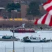 Black Boxes Recovered From Jet Involved In DC Plane-Helicopter Collision 12 A diving team and police boat at the Potomac River.