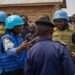 UN police officers talk to displaced people in a camp close to eastern Democratic Republic of the Congo provincial capital Goma.