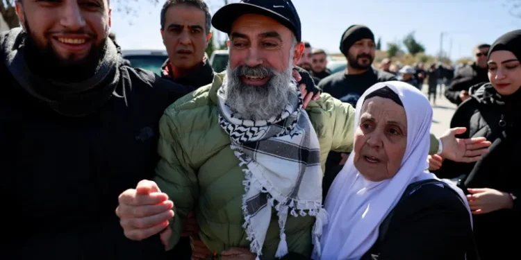 Israel Frees Palestinian Prisoners After 3 Captives Released In Gaza 1 A freed Palestinian prisoner reacts in Ramallah as Palestinian prisoners are released.