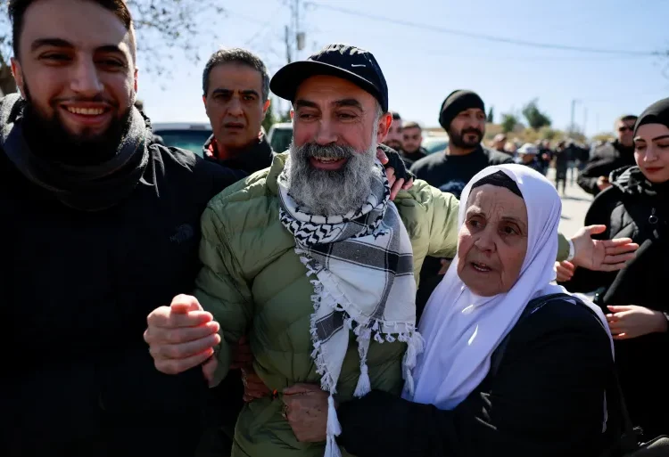 A freed Palestinian prisoner reacts in Ramallah as Palestinian prisoners are released.