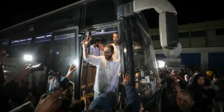 Freed Palestinian prisoners flash V-signs as they arrive in Khan Younis, Gaza Strip, February 27, 2025.
