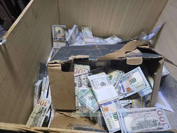 A picture of the  stockpile of counterfeit currency and suspected gold bars discovered in Sarpeiman